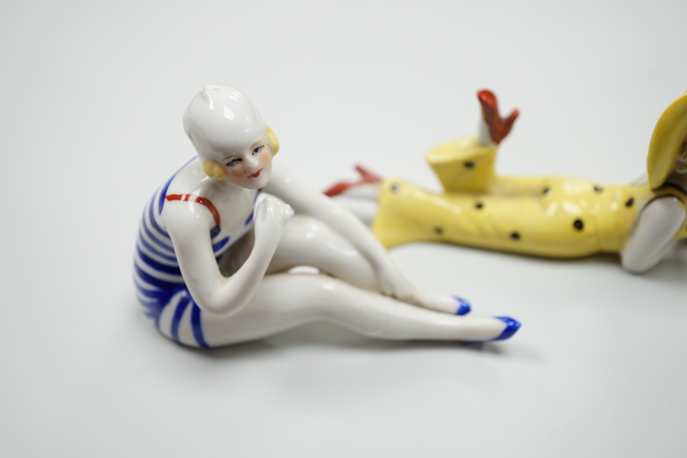 Two German Art Deco porcelain models of bathing beauties, longest 14.5cm